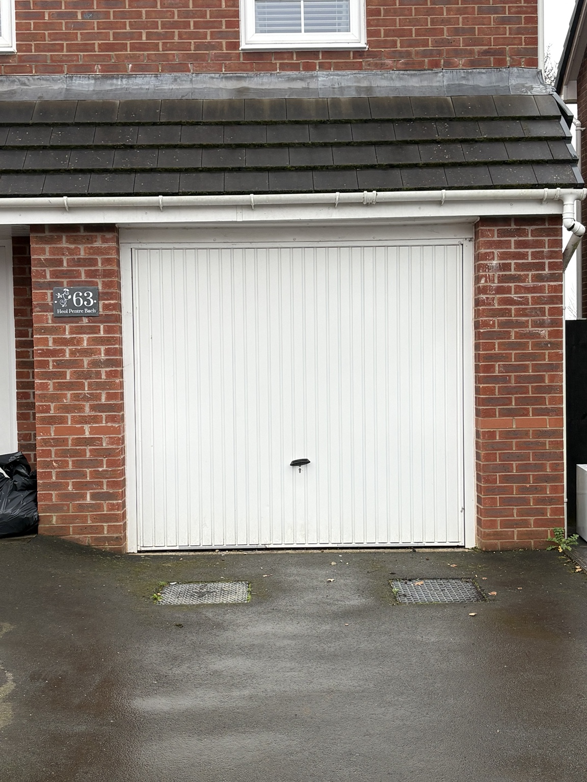 Garage before conversion with original garage door